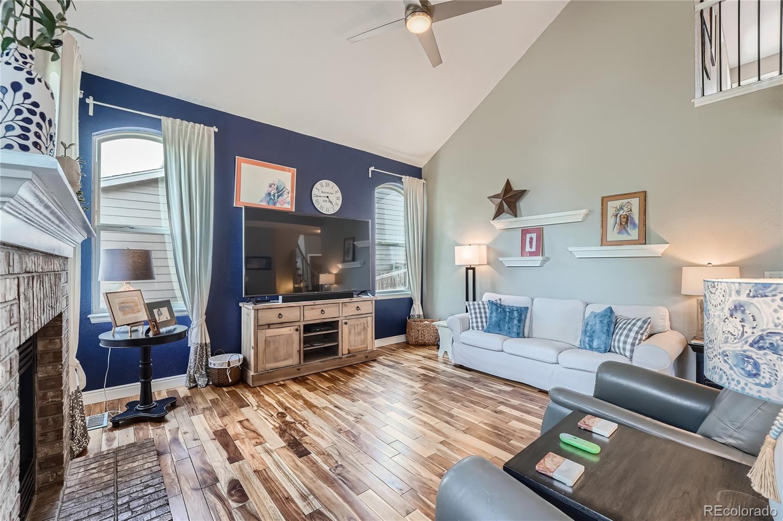 9538 La Quinta Drive Lone Tree, CO 80124 - Photo 17 of 41 a large living room with furniture and a flat screen tv