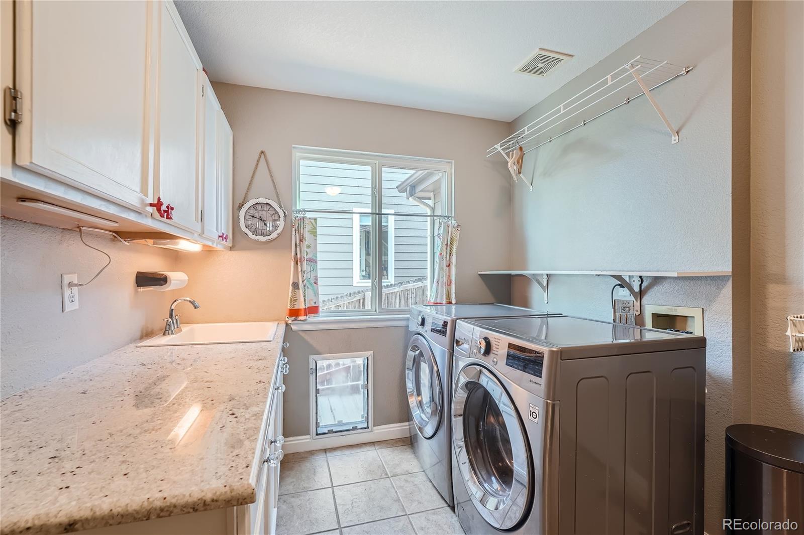 9538 La Quinta Drive Lone Tree, CO 80124 - Photo 19 of 41 a utility room with dryer and washer