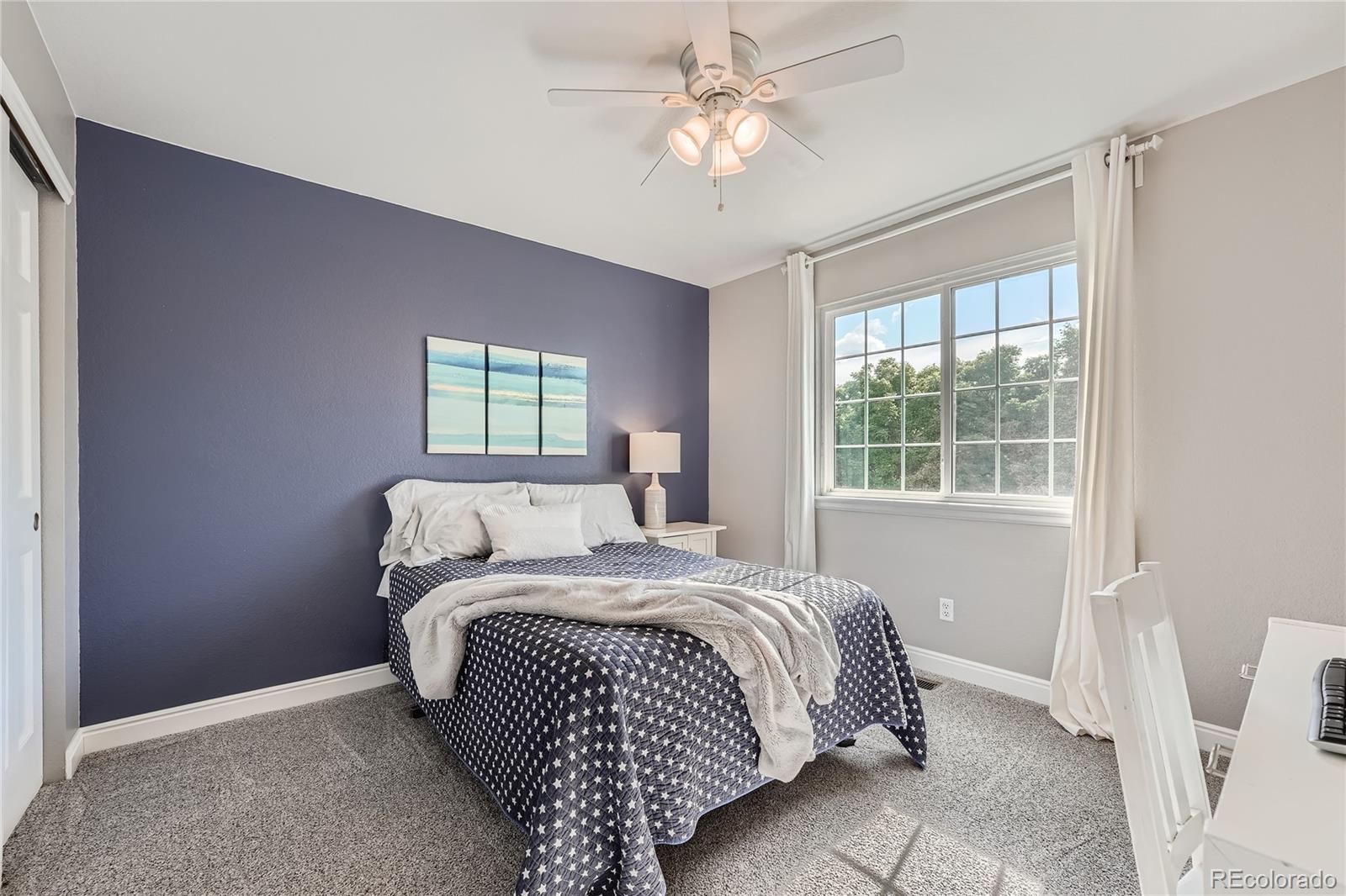9538 La Quinta Drive Lone Tree, CO 80124 - Photo 25 of 41 a bedroom with a bed and a window