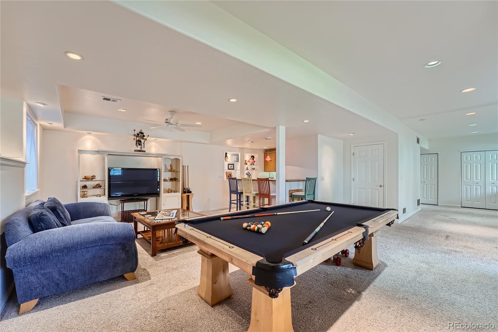 9538 La Quinta Drive Lone Tree, CO 80124 - Photo 29 of 41 a living room with furniture pool table and flat screen tv