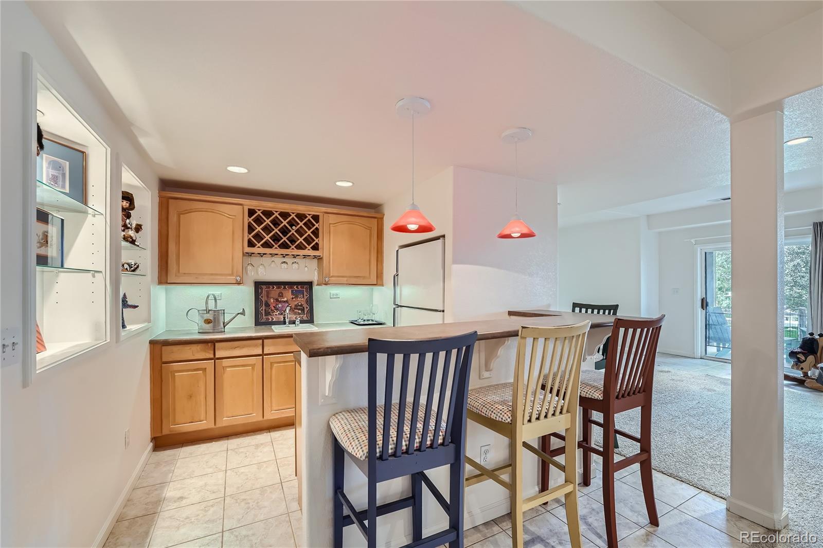 9538 La Quinta Drive Lone Tree, CO 80124 - Photo 31 of 41 a dining area with a table chairs and a window