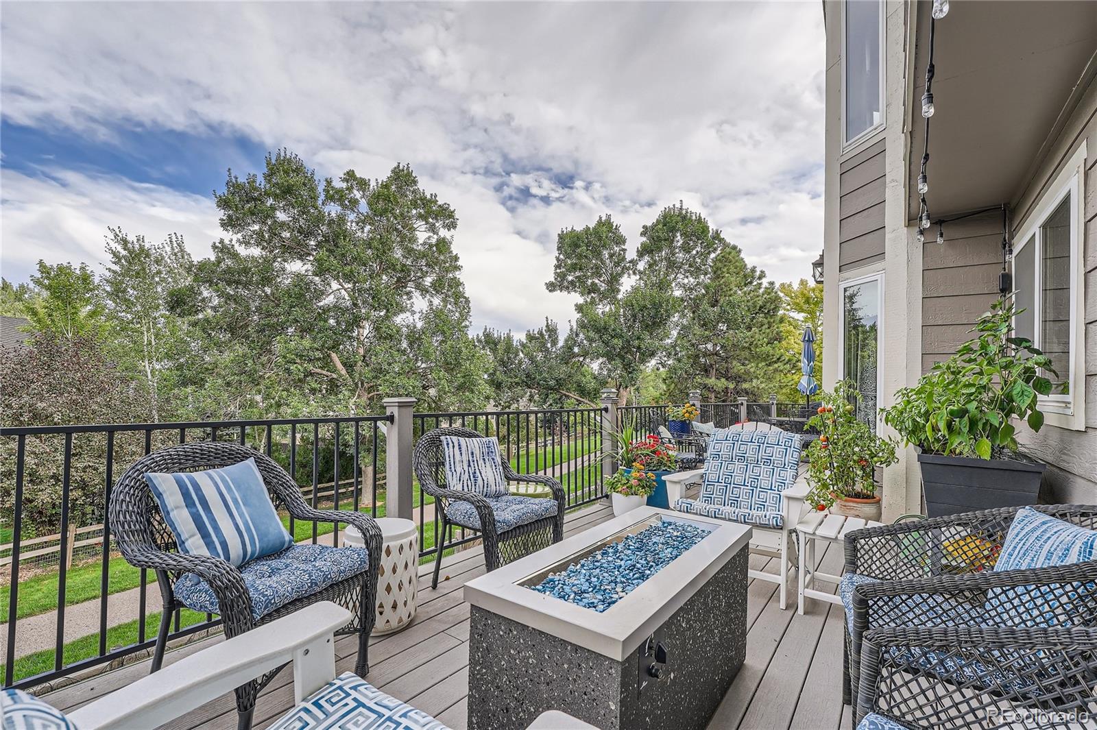 9538 La Quinta Drive Lone Tree, CO 80124 - Photo 33 of 41 a view of a balcony with two chairs and a table