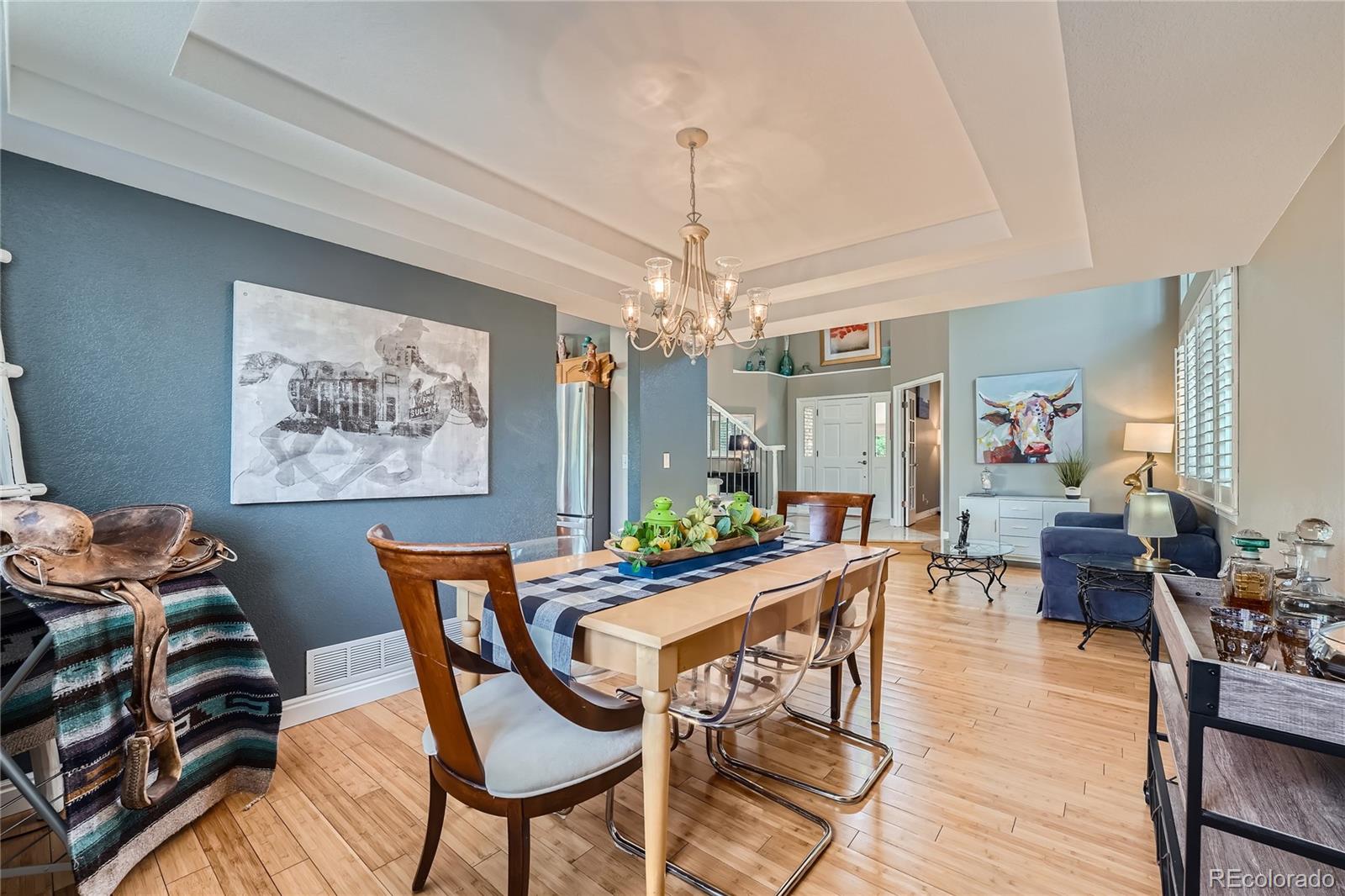 9538 La Quinta Drive Lone Tree, CO 80124 - Photo 9 of 41 a view of a dining room with furniture window and wooden floor