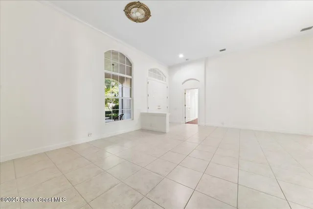 a large kitchen with kitchen island a stove a sink dishwasher and a refrigerator with wooden floor