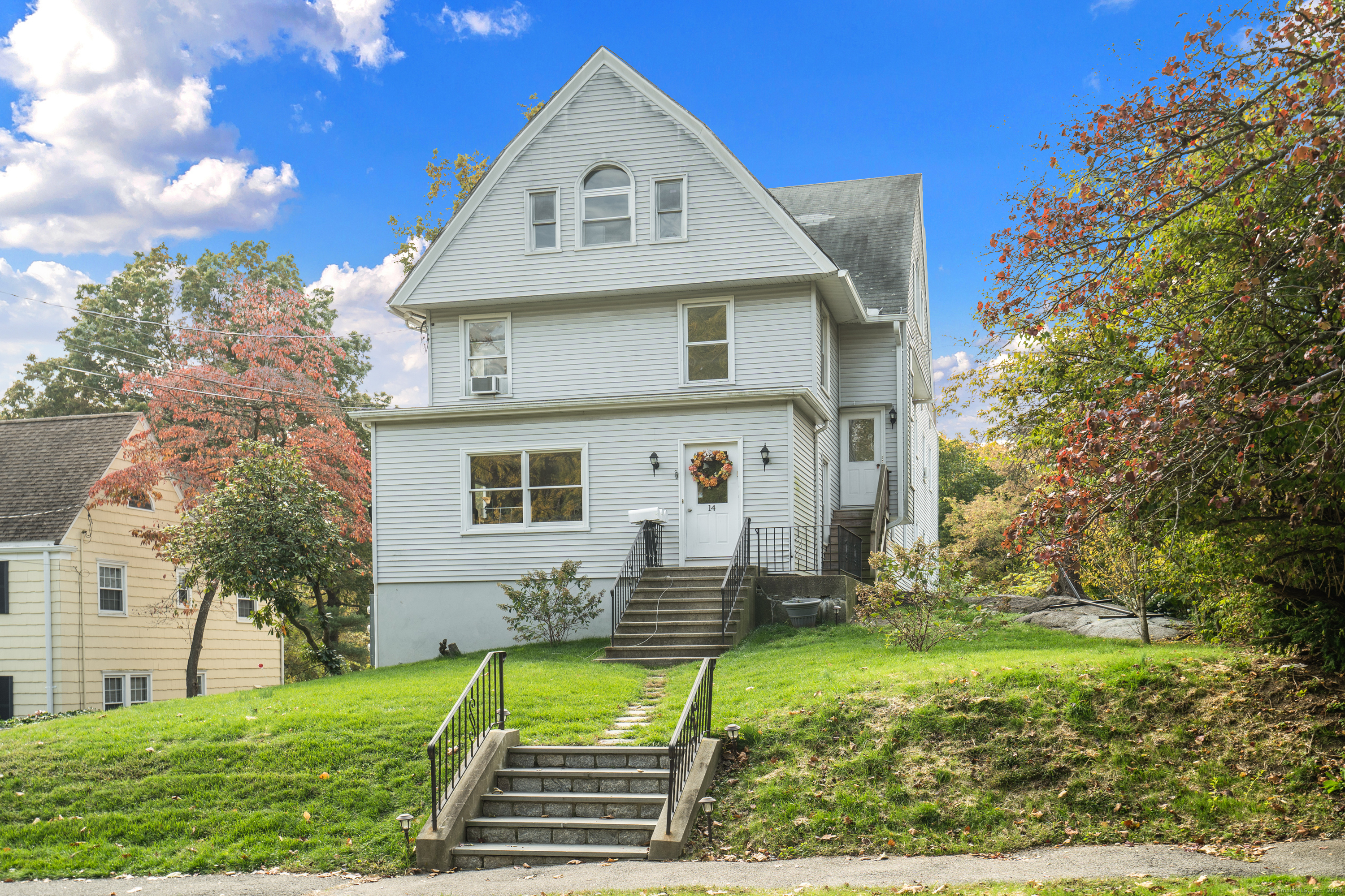 a front view of a house with a yard