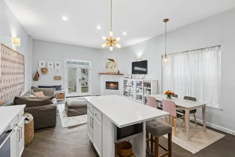 a view of kitchen with a table and chairs