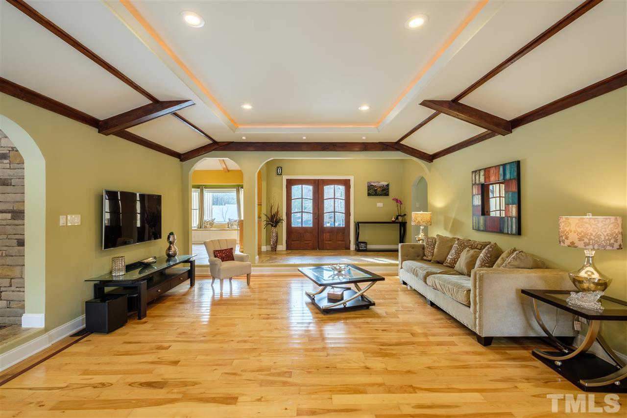 720 Malbay Lane Raleigh, NC 27615 - Photo 22 of 25 a living room with fireplace furniture and flat screen tv