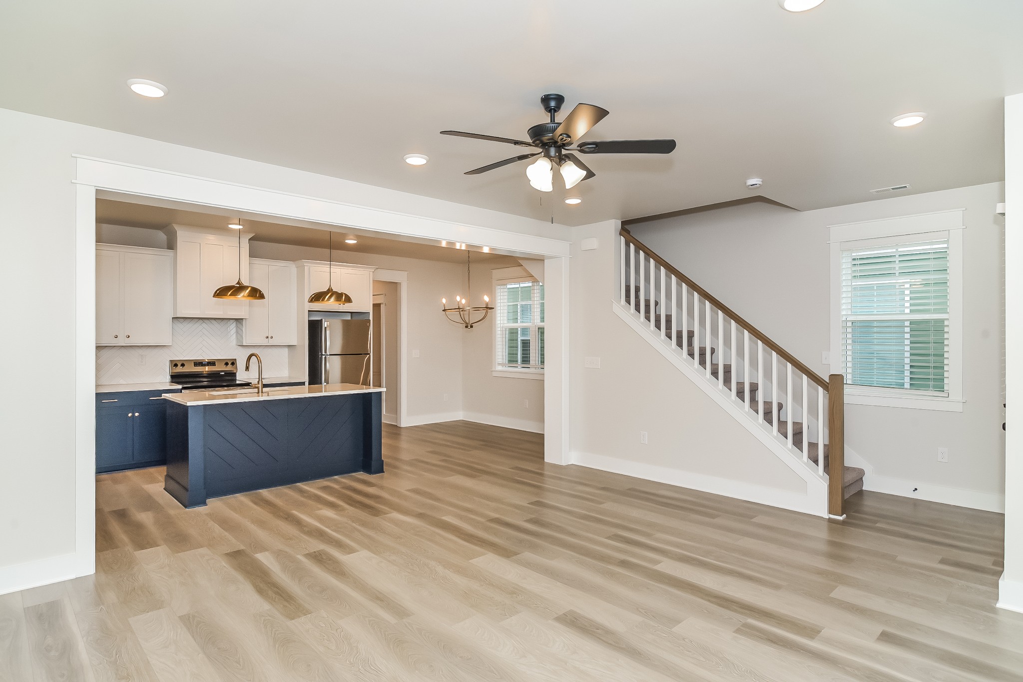 228 Sounder Circle La Vergne, TN 37086 - Photo 4 of 17 a kitchen with granite countertop a refrigerator and a view of living room