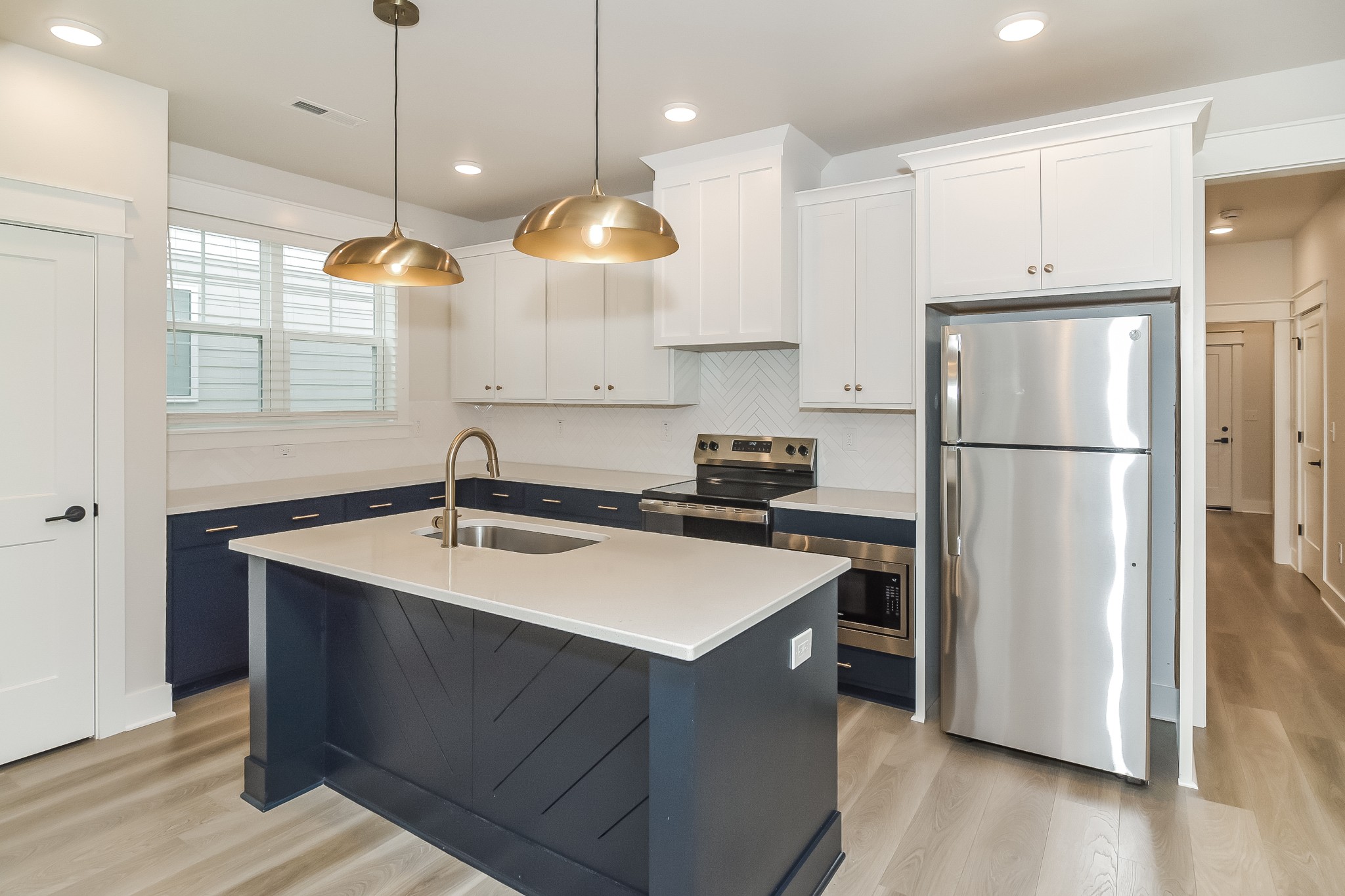 228 Sounder Circle La Vergne, TN 37086 - Photo 6 of 17 a kitchen with a refrigerator a sink and a large window