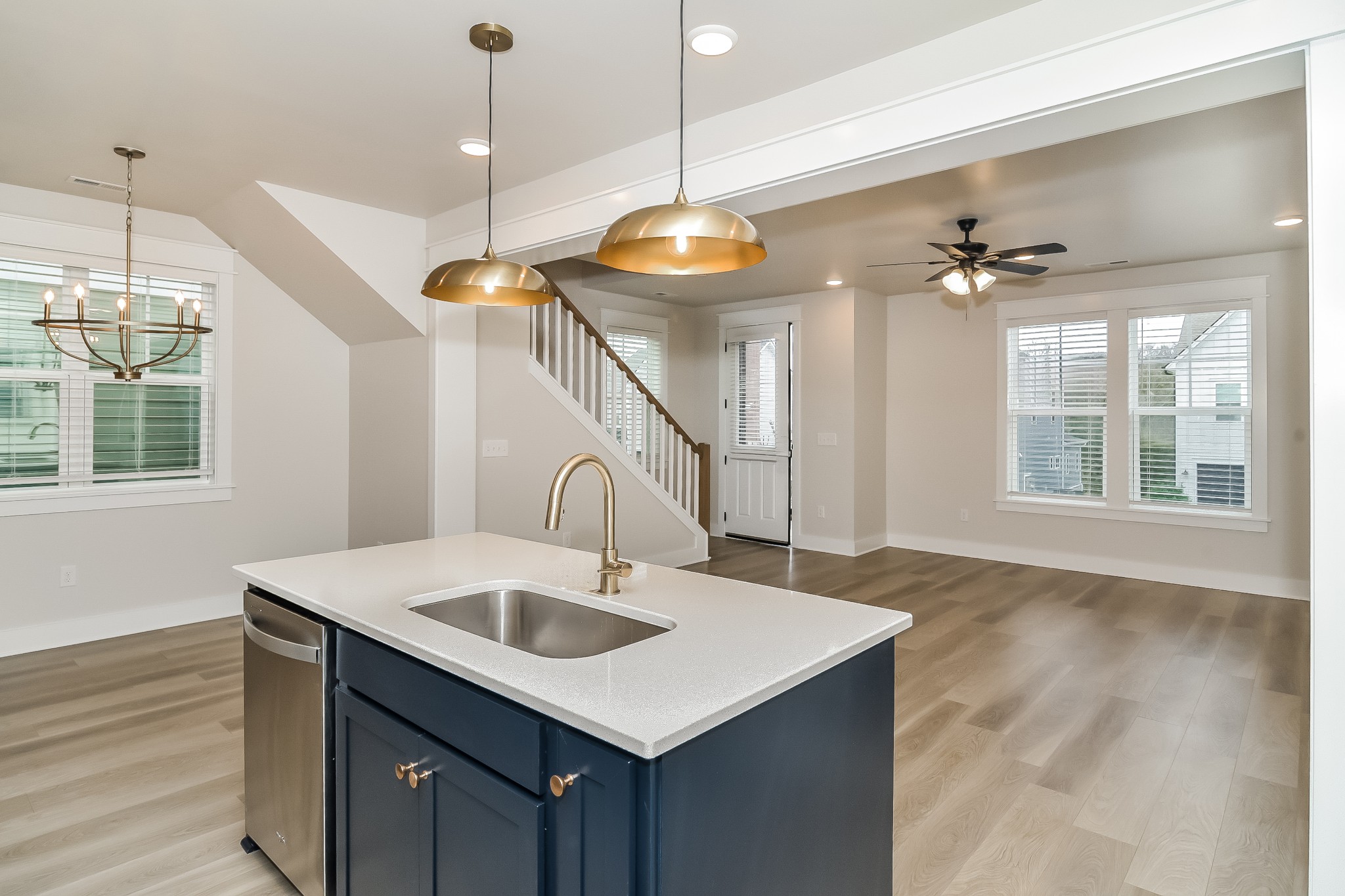 228 Sounder Circle La Vergne, TN 37086 - Photo 7 of 17 a kitchen with a sink a chandelier and wooden floor