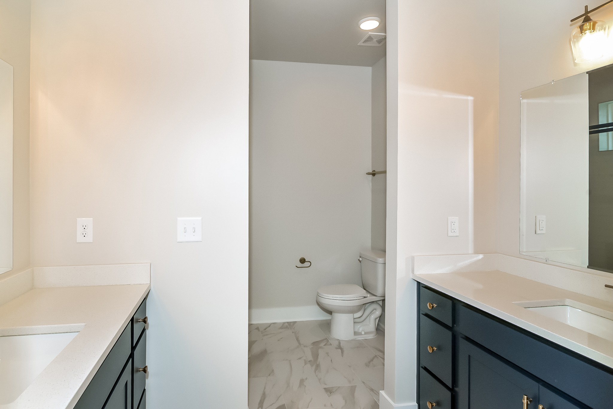 228 Sounder Circle La Vergne, TN 37086 - Photo 9 of 17 a bathroom with a sink a toilet and a large mirror