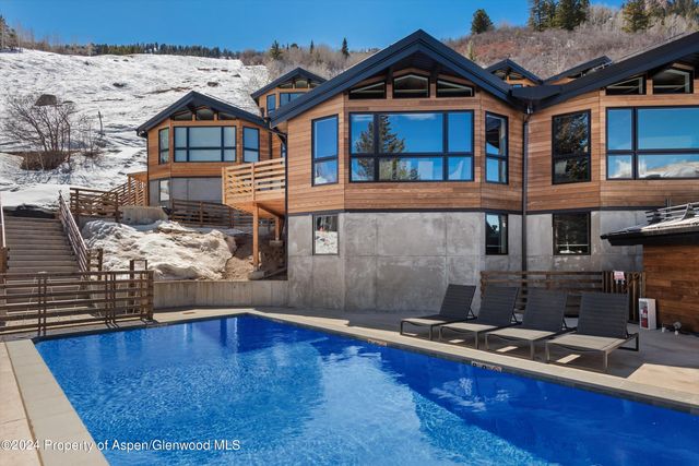 a front view of a house with swimming pool