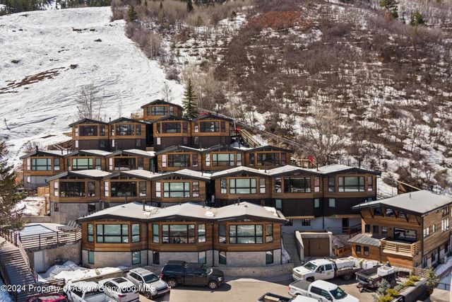 a front view of a building with sitting area