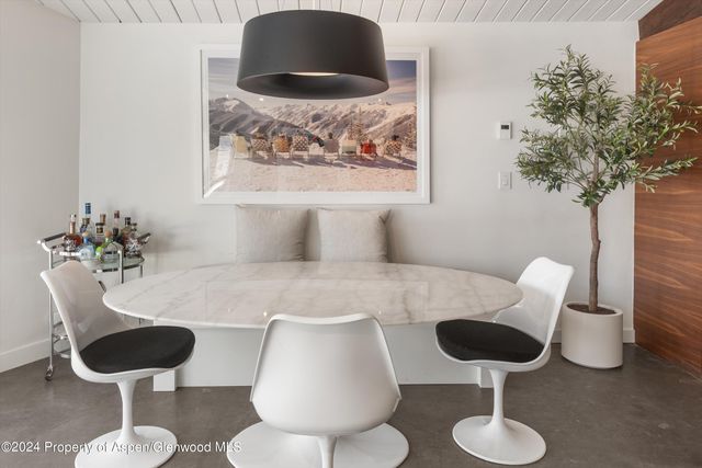 a table with a vase and a vase on it