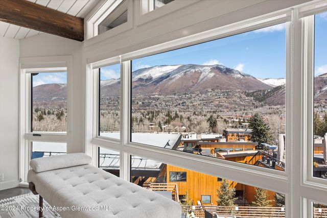a view of a living room and kitchen with furniture