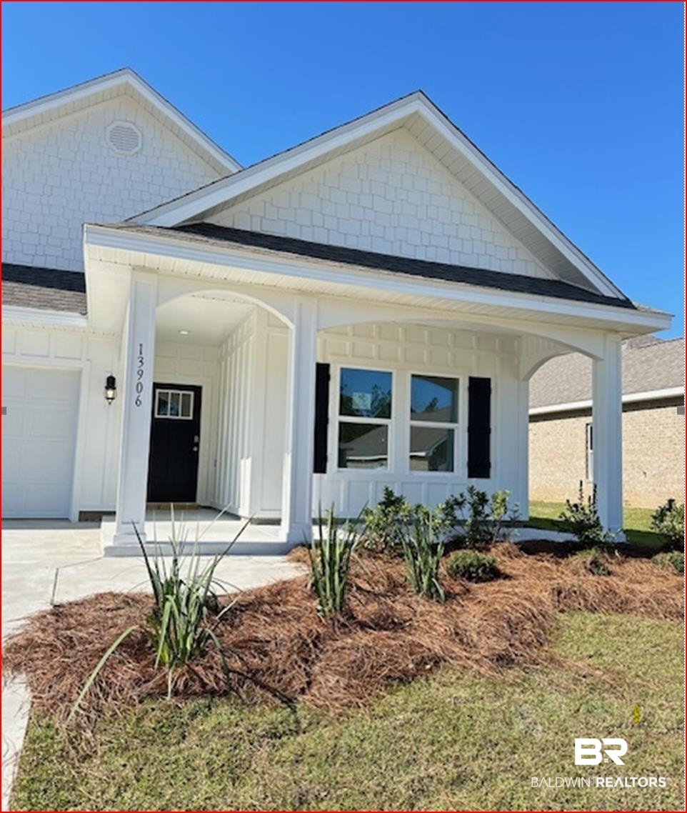 13906 Antler Hl Road Daphne, AL 36527 - Photo 2 of 23 View of front of house with covered porch and a garage