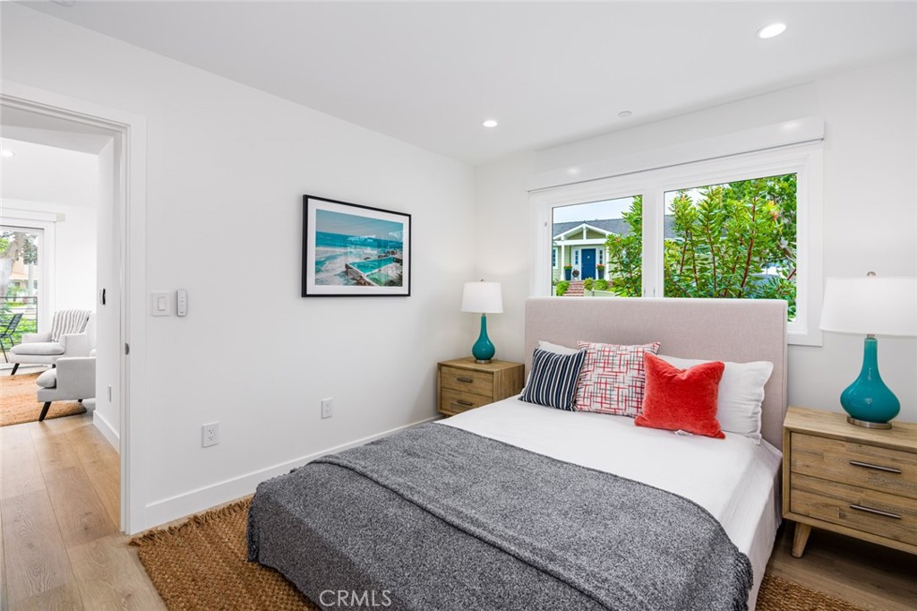 480 Morning Canyon Road Corona del Mar, CA 92625 - Photo 11 of 33 a bedroom with a bed and wooden floor