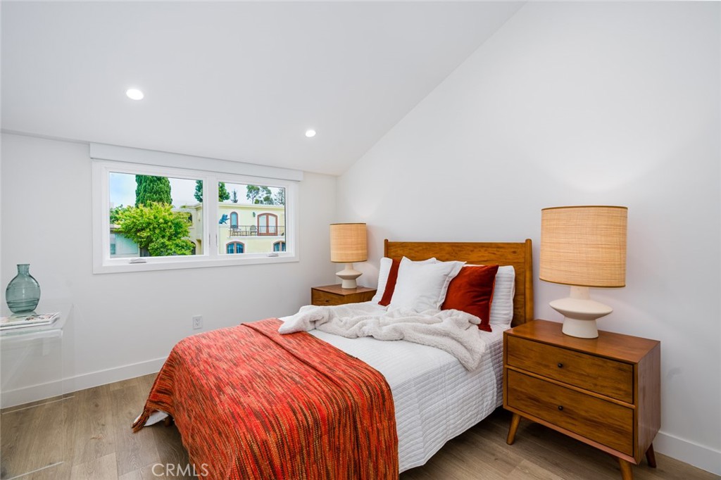 480 Morning Canyon Road Corona del Mar, CA 92625 - Photo 13 of 33 a bedroom with a bed a window and potted plant