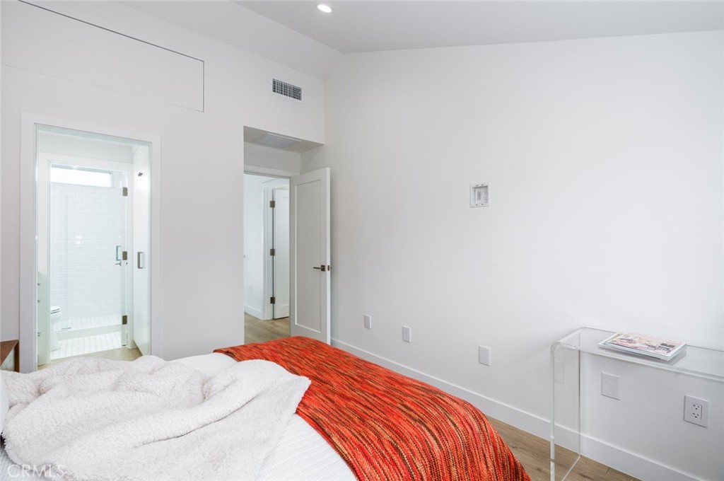 480 Morning Canyon Road Corona del Mar, CA 92625 - Photo 14 of 33 a bedroom with a bed and cabinets