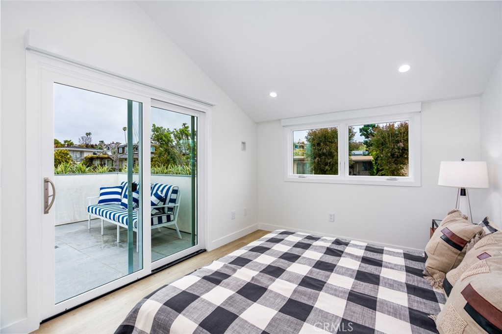 480 Morning Canyon Road Corona del Mar, CA 92625 - Photo 16 of 33 a bedroom with a bed and a lamp next to a window