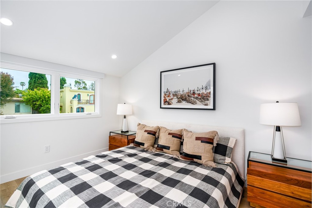 480 Morning Canyon Road Corona del Mar, CA 92625 - Photo 17 of 33 a bedroom with bed and a window