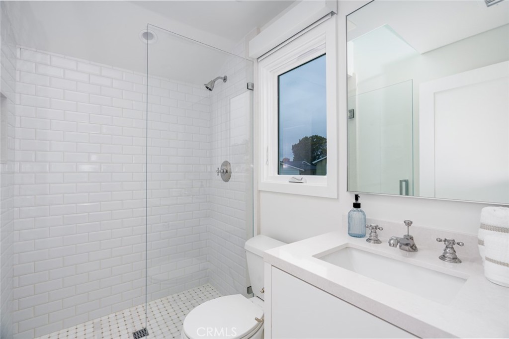 480 Morning Canyon Road Corona del Mar, CA 92625 - Photo 18 of 33 a bathroom with a sink toilet and shower