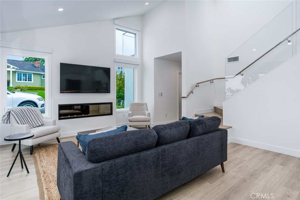 480 Morning Canyon Road Corona del Mar, CA 92625 - Photo 2 of 33 a living room with furniture and a flat screen tv