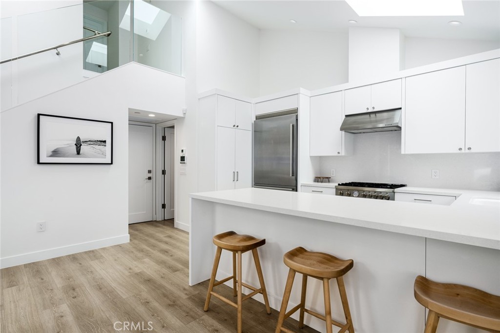 480 Morning Canyon Road Corona del Mar, CA 92625 - Photo 6 of 33 a kitchen with stainless steel appliances granite countertop a sink and a refrigerator
