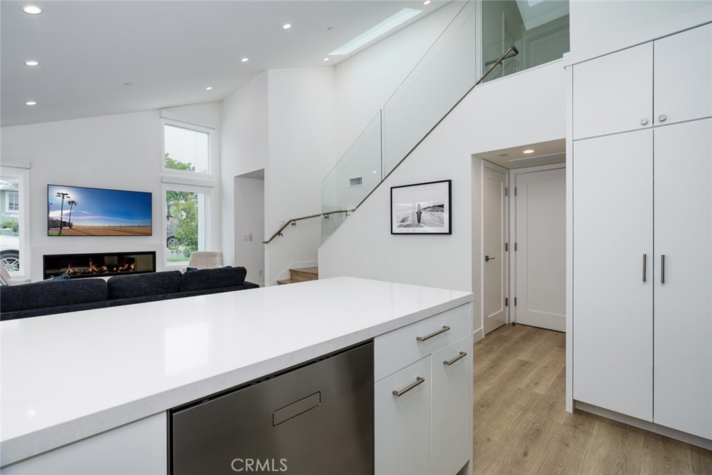480 Morning Canyon Road Corona del Mar, CA 92625 - Photo 9 of 33 a kitchen with a sink and a refrigerator