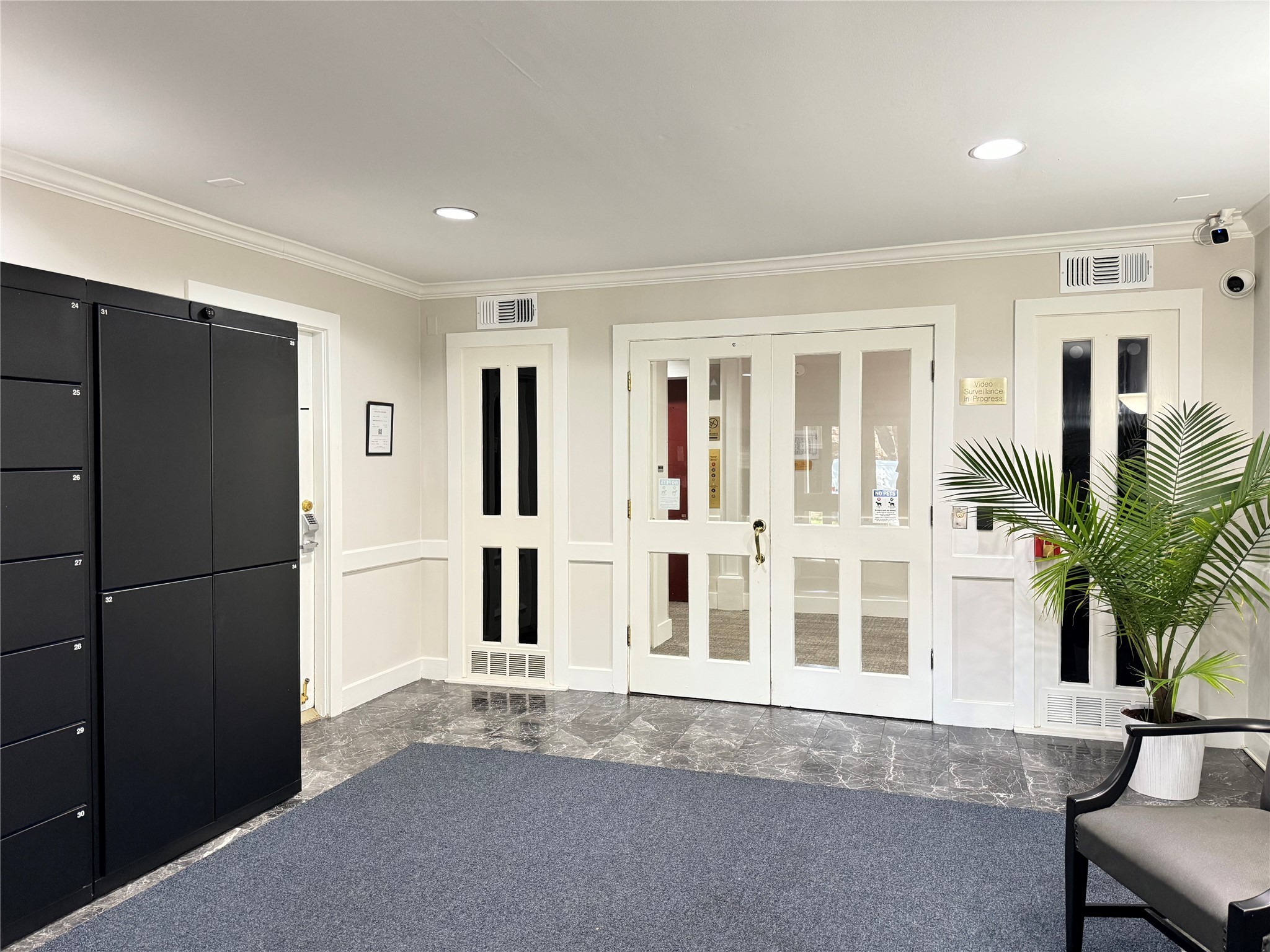 357 North Post Oak Lane, Unit 209 Houston, TX 77024 - Photo 14 of 20 a living room with a refrigerator and a fireplace