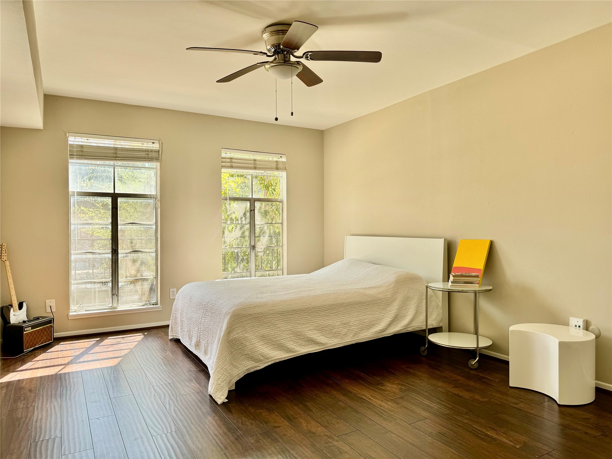 357 North Post Oak Lane, Unit 209 Houston, TX 77024 - Photo 5 of 20 a bedroom with a bed and wooden floor