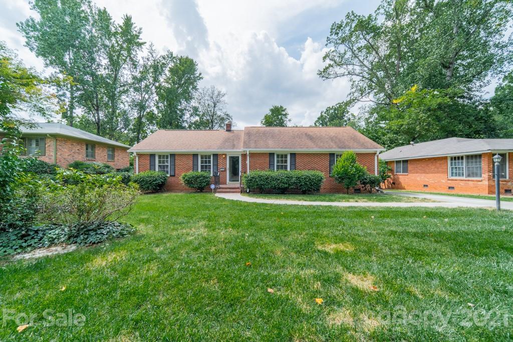 5330 Valley Forge Road Charlotte, NC 28210 - Photo 2 of 27 a front view of a house with a yard and trees