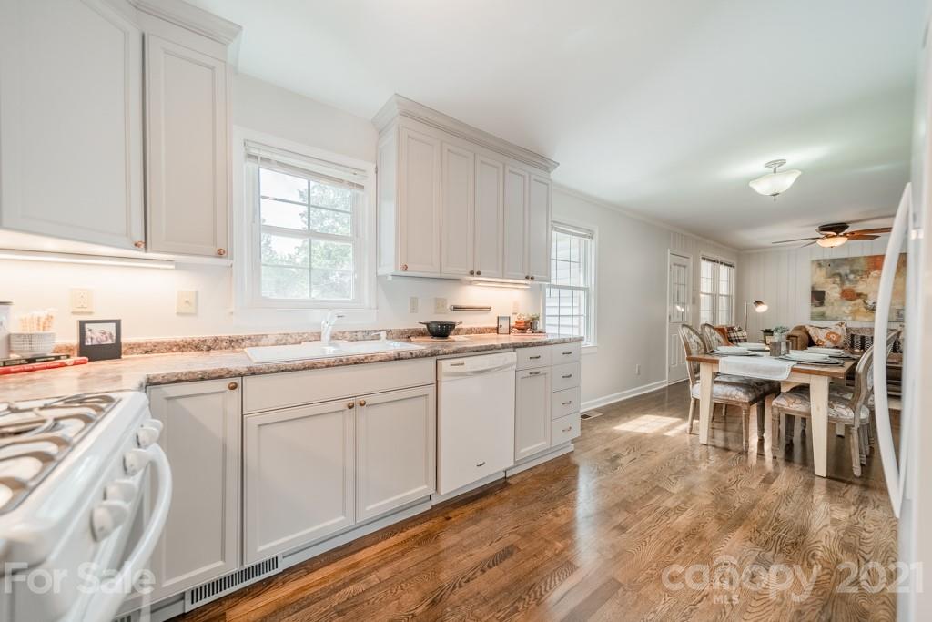 5330 Valley Forge Road Charlotte, NC 28210 - Photo 11 of 27 a kitchen with a sink cabinets and window