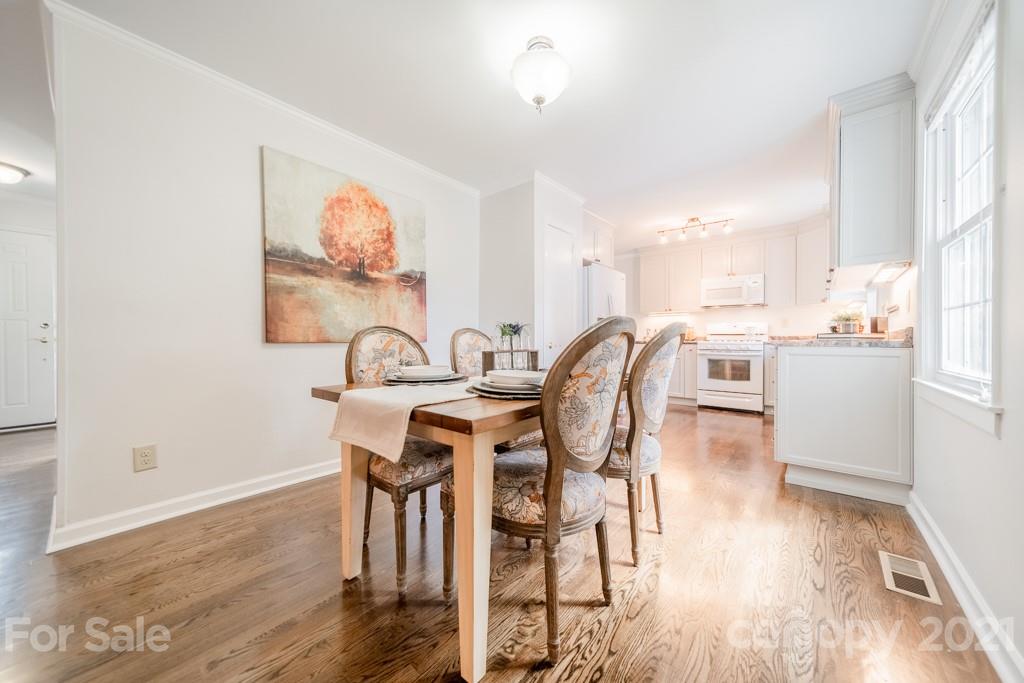 5330 Valley Forge Road Charlotte, NC 28210 - Photo 13 of 27 a view of a dining room with furniture and wooden floor
