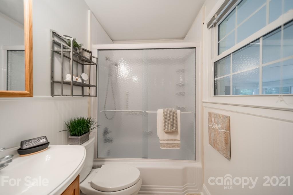 5330 Valley Forge Road Charlotte, NC 28210 - Photo 19 of 27 a bathroom with a toilet and a shower