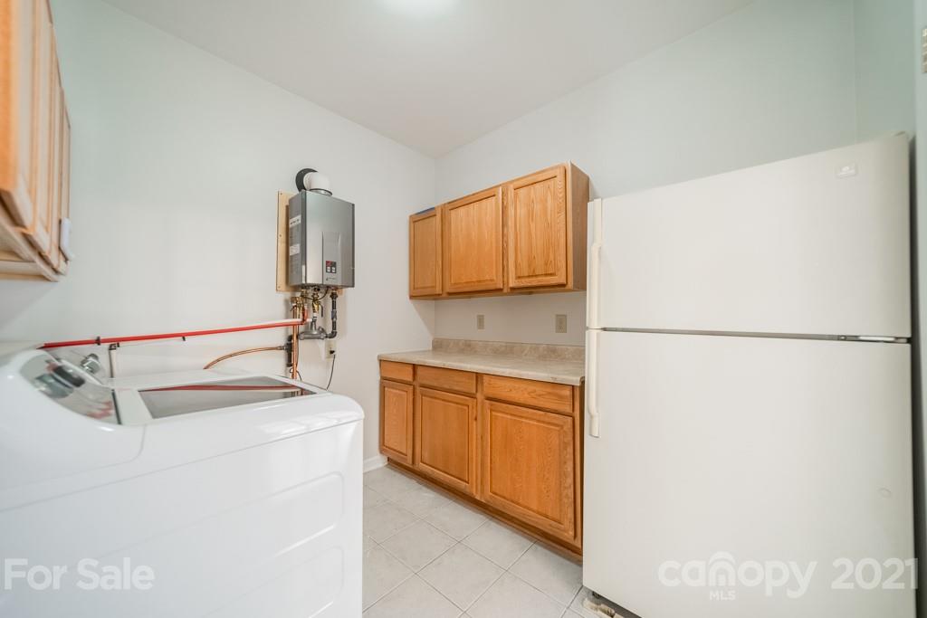 5330 Valley Forge Road Charlotte, NC 28210 - Photo 23 of 27 a kitchen with stainless steel appliances granite countertop white refrigerator sink and stove