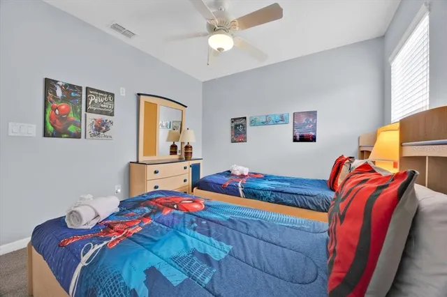 a bedroom with bed and a window