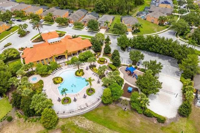 an aerial view of residential houses with outdoor space