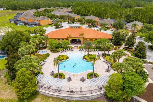 a view of a swimming pool with a yard