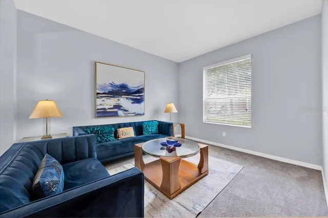 a living room with furniture and window