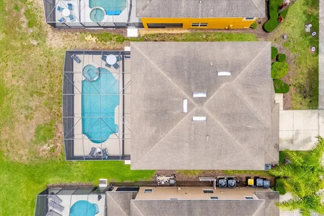 view of pool with seating area and small yard