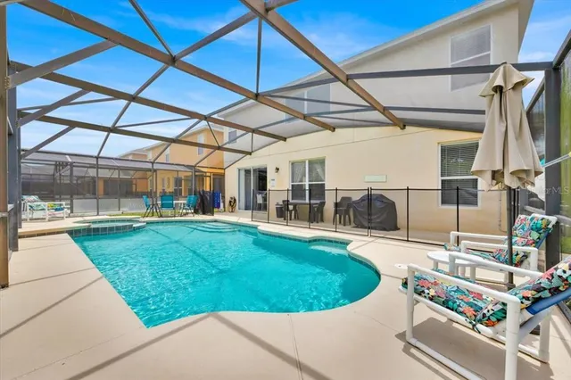 a view of a swimming pool with a patio