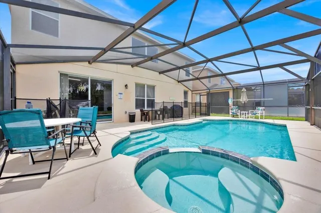 a view of a swimming pool with a patio