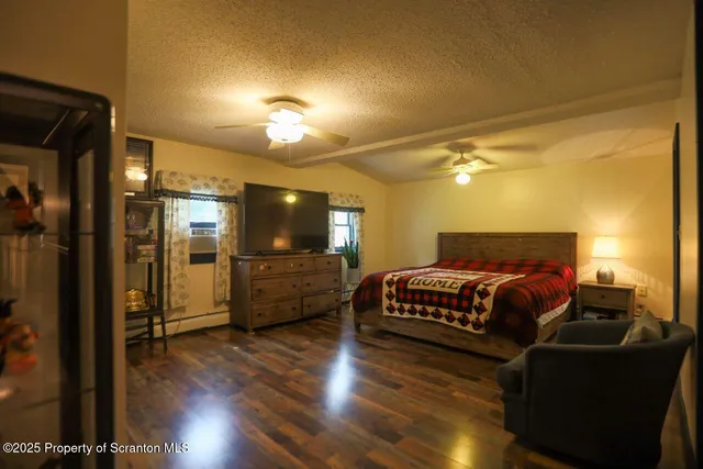 a bedroom with a bed and a mirror