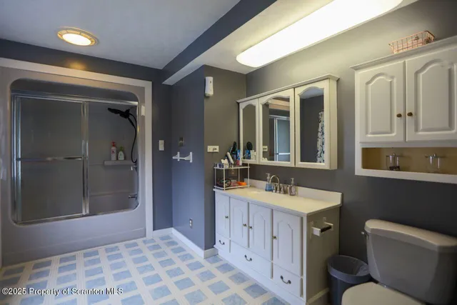 a living room with stainless steel appliances kitchen island granite countertop furniture and a kitchen view