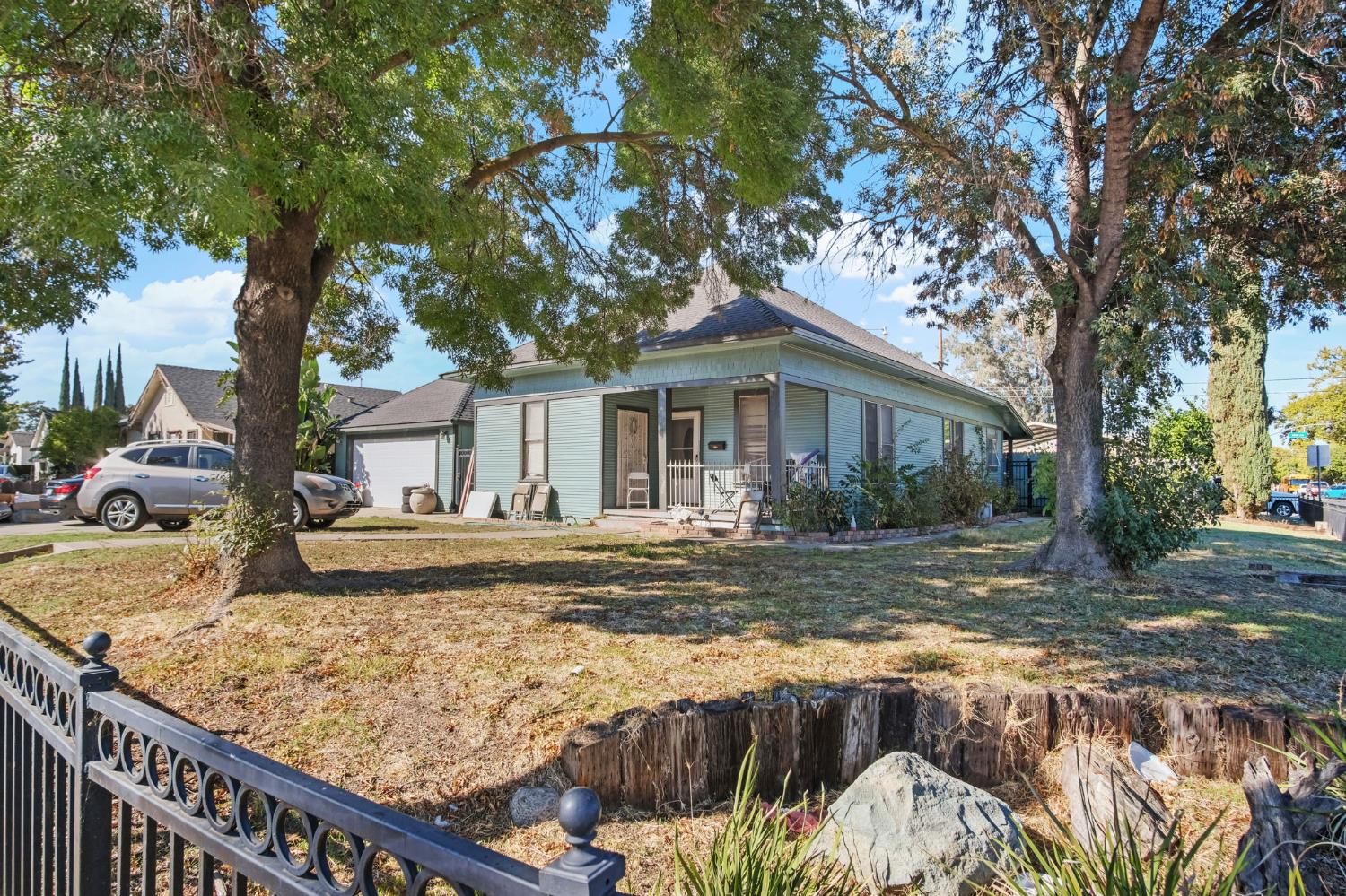402 Maple Street Modesto, CA 95351 - Photo 1 of 1 front view of a house with a yard