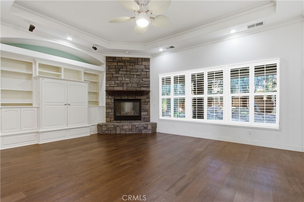 2144 King Arthur Court Merced, CA 95340 - Photo 11 of 66 a view of an empty room with a fireplace and a window