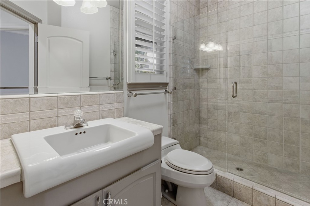 2144 King Arthur Court Merced, CA 95340 - Photo 18 of 66 a bathroom with a sink a toilet and shower