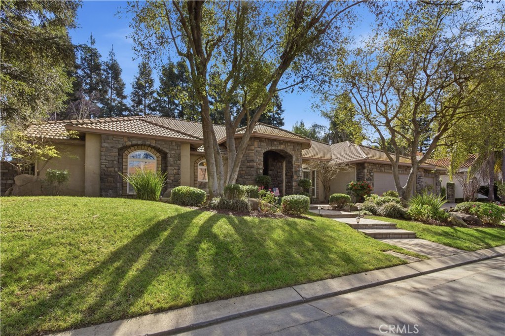 2144 King Arthur Court Merced, CA 95340 - Photo 2 of 66 a view of a house with backyard and tree