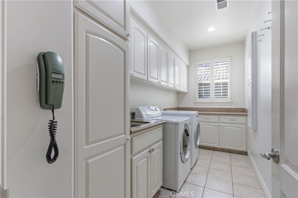 2144 King Arthur Court Merced, CA 95340 - Photo 22 of 66 a kitchen with a sink and cabinets